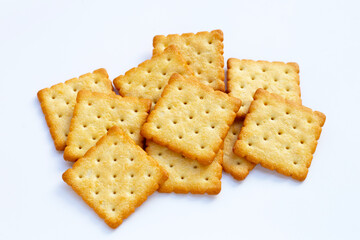 Dry cracker cookies on white background.