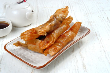 pisang coklat or piscok, is a sweet snack from Indonesia. It is made from sliced ​​bananas with...