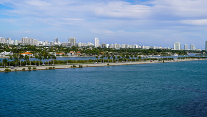 Fototapeta premium Beautiful aerial panoramic view of the city of Miami, its buildings, marina, yachts and luxurious suburbs houses