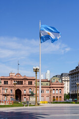 Fototapeta na wymiar Plaza de Mayo in Buenos Aries. Central square in Buenos Aires with the Argentinean flag in the summer next to the presidential palace. Attractions, travel and tourism in Argentina.