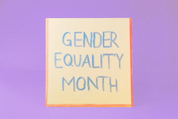 Card with text Gender Equality Month on violet background