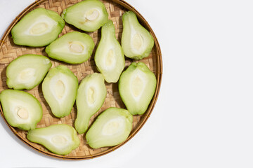 Fresh chayote fruit on white background.