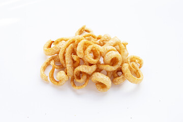 Fried crispy pork rinds on white background.