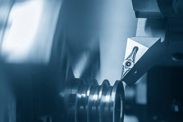 The  CNC lathe machine V-groove   cutting operation.