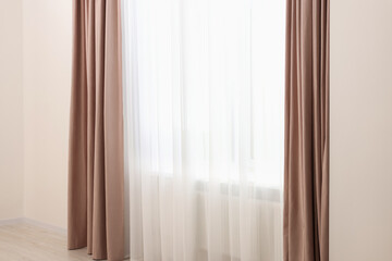 Naklejka na ściany i meble Elegant window curtains and white tulle indoors. Interior design
