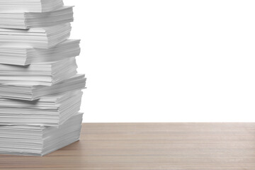 Stack of paper sheets on wooden table against white background. Space for text