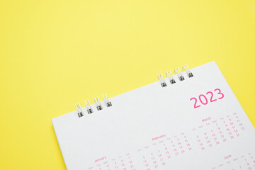 white calendar 2023 on yellow background