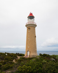 Fototapeta na wymiar Cape du Couedic lighthouse in Flinders Chase on Kangaroo Island, South Australia. Southern Indian Ocean in the distance.