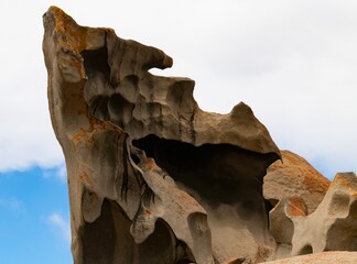 Remarkable Rocks in Flinders Chase National Park on Kangaroo Island, South Australia. Rocks covered by golden orange lichen. Black mica, bluish quartz and pinkish feldspar comprise most of the granite