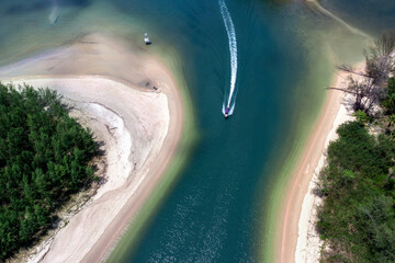 Aerial view of Long boat is moving at high speed on the sea. Krabi, Thailand.
