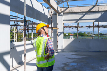 Obraz premium Side view of female engineer using walkie-talkie in construction site for building site survey in civil engineering project.