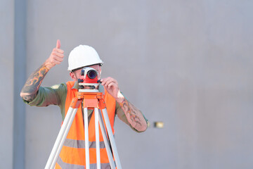 Survey engineers at construction sites use theodolite to mark coordinating concrete piles.
