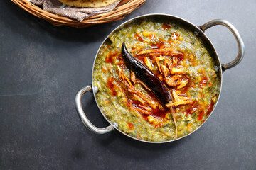 Sarson ka saag and Makke di roti. mustard leaves curry. It's a popular Punjabi winter dish made...