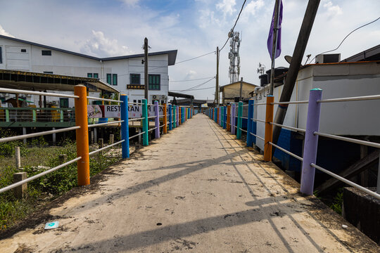 Pulau Ketam, Malaysia - December 26, 2022: Pulau Ketam translated means crab island, It is a small island located off the coast of Klang. Street view of the fisher man village built entirely on stilts