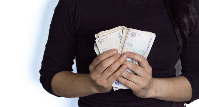 Woman In Black Counting Money, Colombian Peso