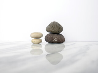 Zen basalt stone on white marble background