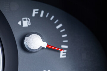 Expensive petrol concept rising cost of living - petrol gauge indicator on empty