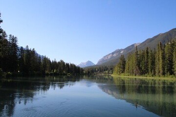 Fototapeta na wymiar Calm Reflections On Bow River, Banff National Park, Alberta