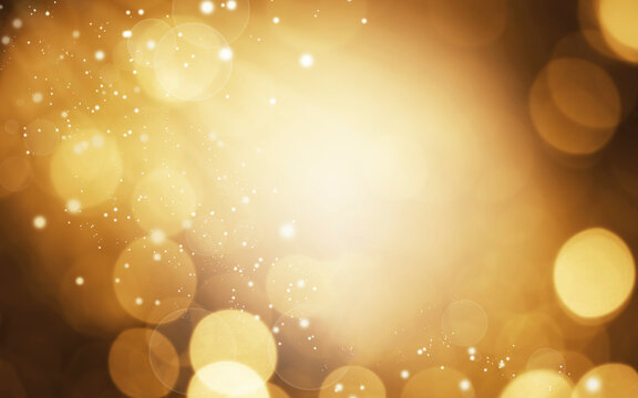 Beautiful Gold Bokeh Lights Abstract Background. Celabration Christmas Festive New Year Theme, Xmas Holiday. Glitter Bokeh Defocused Lights, Dust and Stars. 