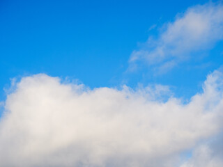 White fluffy soft clouds against a blue sky