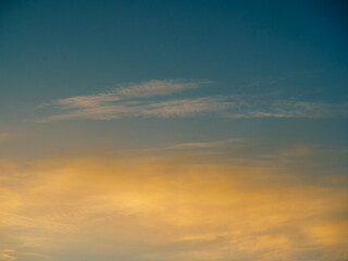 Naklejka na ściany i meble Yellow soft clouds against the morning sky