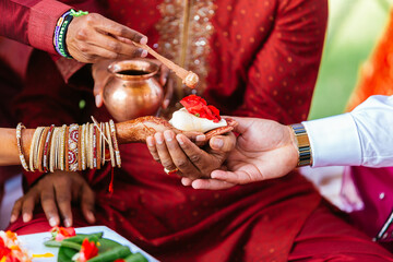 The groom and the bride are attending the ceremony. indian marriage There are offerings and spices...