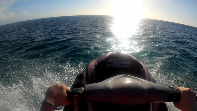 POV riding a Jetski towards the ocean in the caribbean