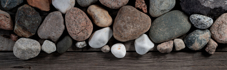 Fototapeta na wymiar Stones on Wooden Rustic Background. Nature, Spa and Relaxation Thematic Mockup Wallpaper for Clipart.