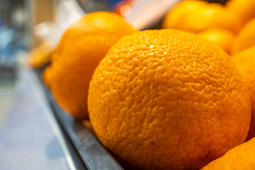 close-up oranges are sold in a shopping center in the department of vegetables and fruits