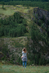 Naklejka premium child walking in the forest