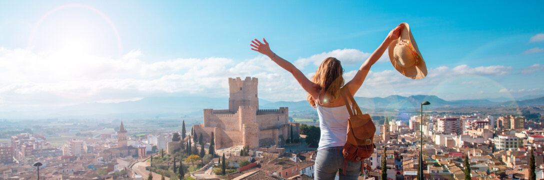 woman tourist enjoying Atalaya castle in Spain