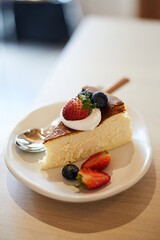 homemade cheesecake on wood table in cafe