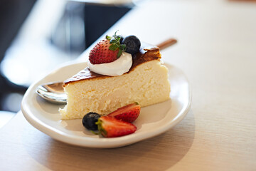 homemade cheesecake on wood table in cafe