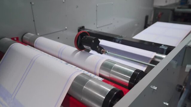 Long Parchment Paper Printed With Borders For Diploma In A Rolling Machine. closeup