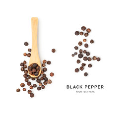 Black peppercorns in wooden spoon isolated on white.
