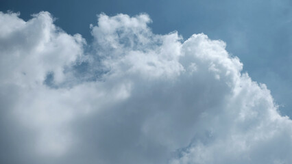 Natural daylight and white clouds floating on blue sky.