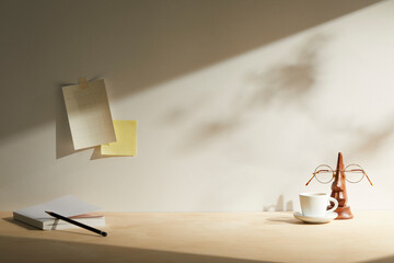 light wooden desk at morning with window light. copy space