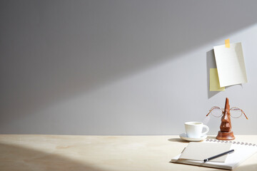 light wooden desk at morning with window light. copy space