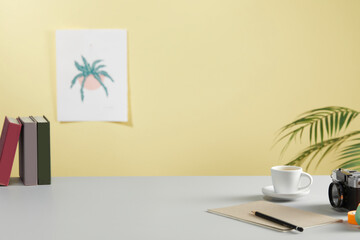 casual office desk with bright yellow background