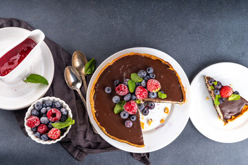 Fototapeta na wymiar Homemade cheesecake with chocolate and berry