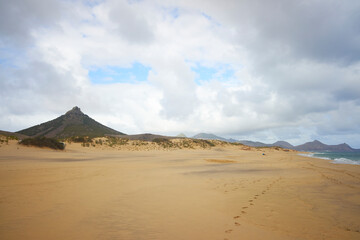 Beach and hill Pico do Facho in Porto Santo island, Portugal.