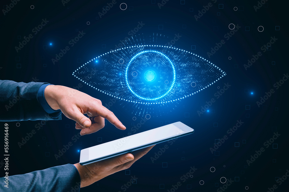 Poster close up of businessman hand pointing at cellphone with glowing digital polygonal eye on dark backgr
