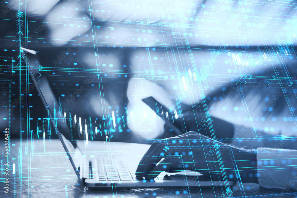 Poster close up of male hands using laptop and cellphone with glowing candlestick forex grid chart on blurr