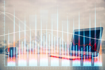 Stock market graph and table with computer background. Double exposure. Concept of financial analysis.