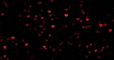  Seamless looping blurred red hearts and glitter motion on clean black background