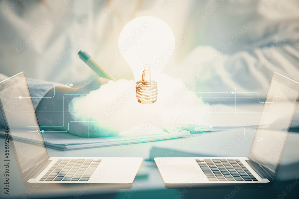 Poster bulb hologram over hands taking notes background. concept of idea. double exposure