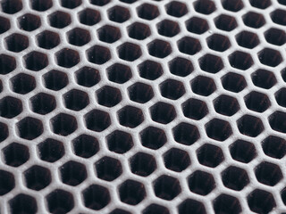 black
 rubber mat as honeycomb background