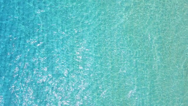 Blue ocean water, aerial view. Transparent sea in tropical island