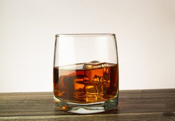 Glass of scotch whiskey and ice.