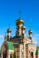 Christian church cross in high steeple tower for prayer